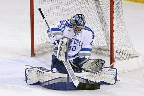 goaltender: a designated player that attempts to prevent the opposing team from scoring by protecting a goal