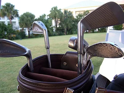 golf club: in golf, the implement used to hit the golf ball