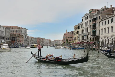gondola: a small long, narrow boat with a high prow and stern, propelled with a single oar, especially in...