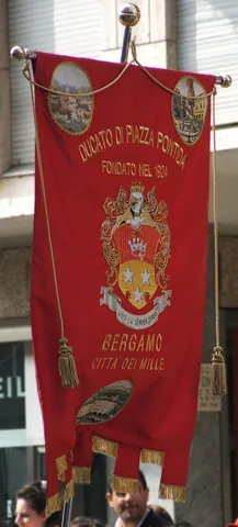 gonfalon: a standard or ensign, consisting of a pole with a crosspiece from which a banner is suspended,...