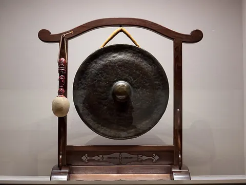 gong: a percussion instrument consisting of a metal disk that emits a loud resonant sound when struck...