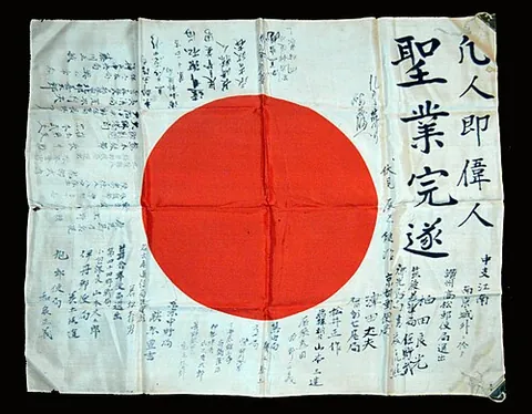 good luck flag: a World War II-era Japanese flag on which is written messages of support for servicemen