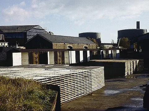 goods yard: an area associated with a railway station where freight is loaded and unloaded