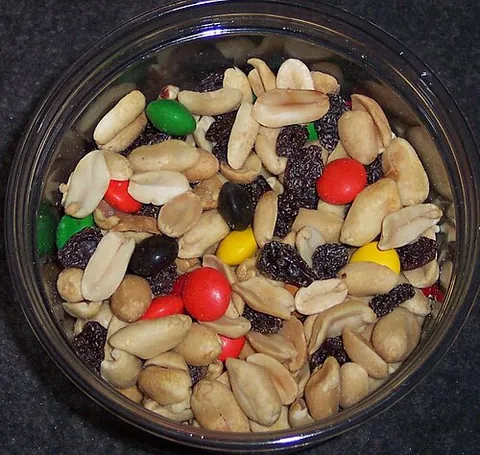 gorp: a loose mixture of dried fruit, nuts, frequently salt, and sometimes other ingredients; designed as...