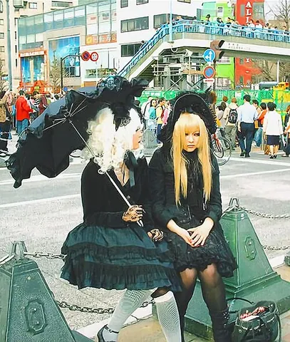 gothic lolita: a Japanese fashion movement whose adherents dress in an elegant, largely monochromatic style with...