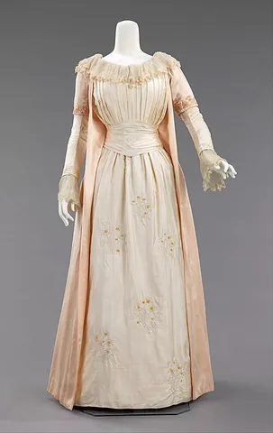 gown: a loose, flowing upper garment