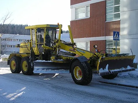 grader: a machine used in road maintenance, construction, and mining for leveling large surfaces