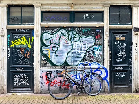 graffiti: drawings or words drawn on a surface in a public place, usually made without authorization