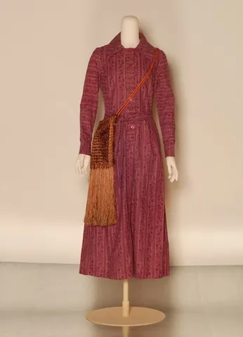 granny dress: a long, loose-fitting, high-necklined one-piece gown or dress, often printed with light or pastel...