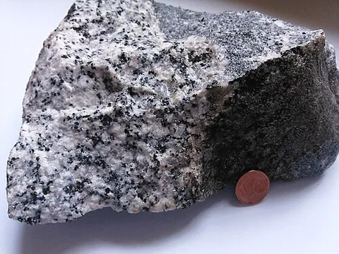granodiorite: an intrusive igneous rock similar to granite, but containing more plagioclase than potassium...