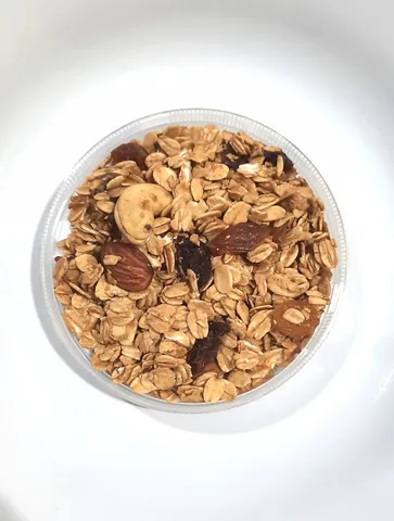 granola: a breakfast and snack food consisting of loose, crispy pellets made of nuts, rolled oats, honey and...