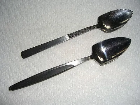 grapefruit spoon: a spoon with a pointed and/or serrated tip designed for separating the flesh of a grapefruit from...