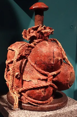 grapeshot: a cluster of small iron balls, put together in a canvas bag in order to be used as a charge for a...