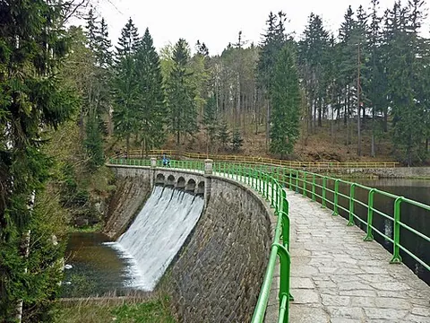 gravity dam: an impoundment dam that is wider at the base than at the top, and which uses the massive weight of...