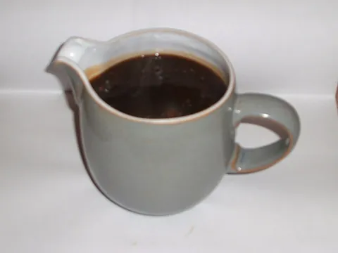 gravy: a dark savoury sauce prepared from stock and usually meat juices; brown gravy