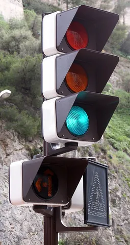 green light: a traffic light in its green state (indicating that vehicles may proceed)