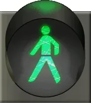 green man: a small figure of a walking man illuminated in green on a traffic light at a pedestrian crossing,...