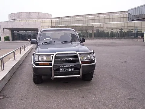 grille guard: a metal frame attached to the bumper of a vehicle in order to protect the grille