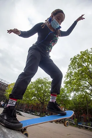 grip tape: sandpaper with an adhesive on one side, used to provide added friction for skateboards, sports...
