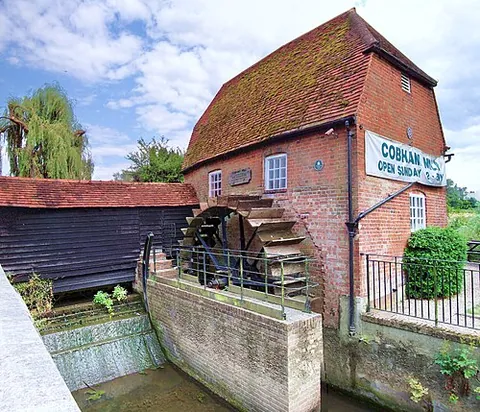 gristmill: a mill that grinds grain; especially, a small-scale local mill that grinds grain brought by a local...