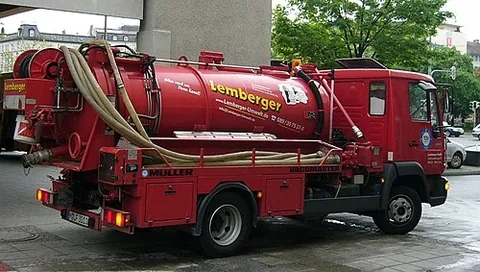 gully emptier: a specialized tank truck with suction gear for removing mud, wastewater, etc