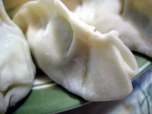 gyoza: a Japanese crescent-shaped dumpling filled with a minced stuffing and steamed, boiled or fried; the...