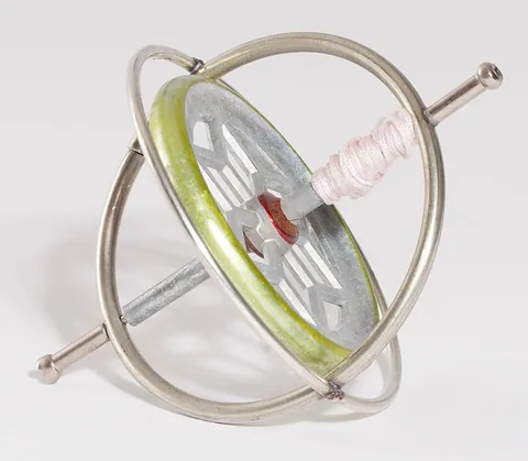 gyroscope: an apparatus composed of a wheel which spins inside of a frame (gimbal) and causes the balancing of...