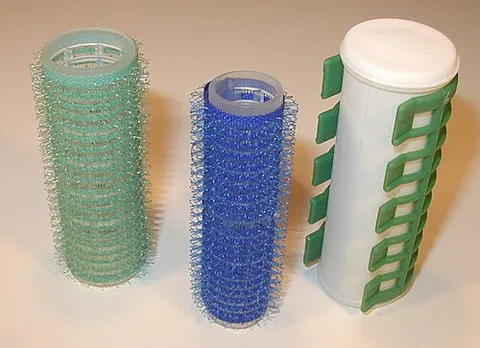 hair roller: a small tube that is rolled into a person's hair in order to curl it, making a new hairstyle