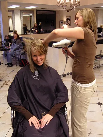 hair salon: the establishment of a beautician or barber