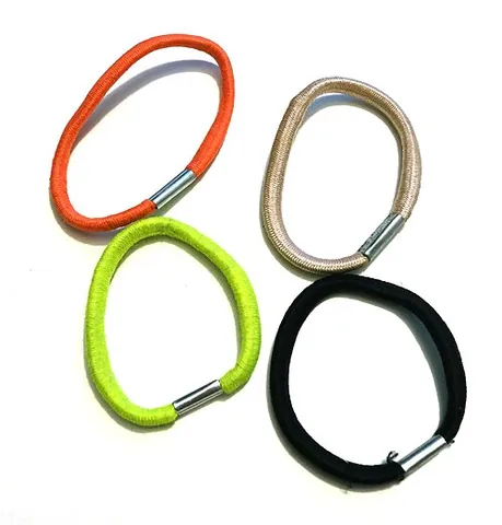 hair tie: a circular piece of elastic used to hold hair in place
