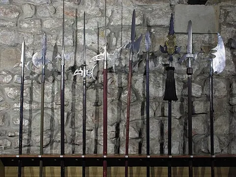 halberd: a two-handed pole weapon, consisting of a long pole with an axe-like blade mounted on it (at a...