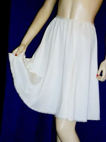 half slip: a slip or undergarment held held to the body around the waist with an elastic waistband