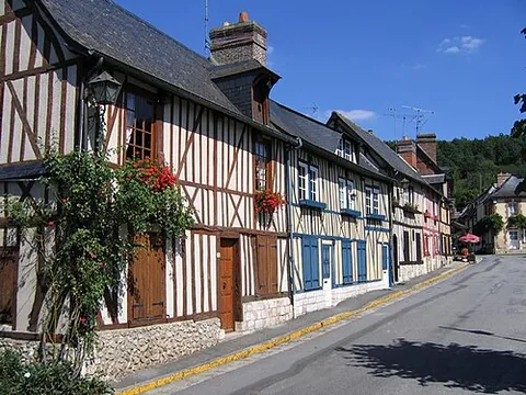 half-timbered: of a building: constructed using a load-bearing timber frame with the spaces (panels) between the...