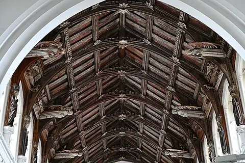 hammer beam: a (short) member of a kind of roof truss (a hammer-beam truss), so framed as not to have a tiebeam...