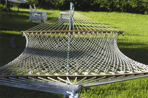 hammock: a swinging couch or bed, usually made of netting or canvas about six feet (1.8 meters) wide,...