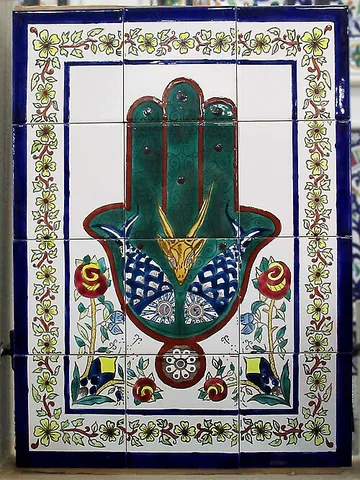 hand of fatima: an apotropaic symbol, in both Jewish and Islamic cultures, serving as a talisman against the "evil...