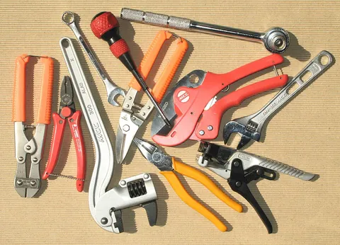 hand tool: a tool powered by human muscular action rather than a motor or engine