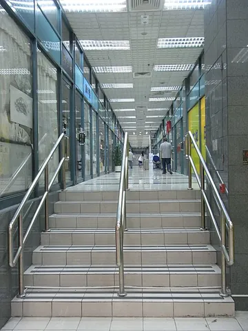 handrail: a rail which can be held, such as on the side of a staircase, ramp, or other walkway, and serving...