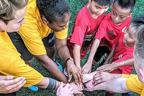 hands-in: a show of unity and usually optimism at the end of an informal huddle of players whereby the...
