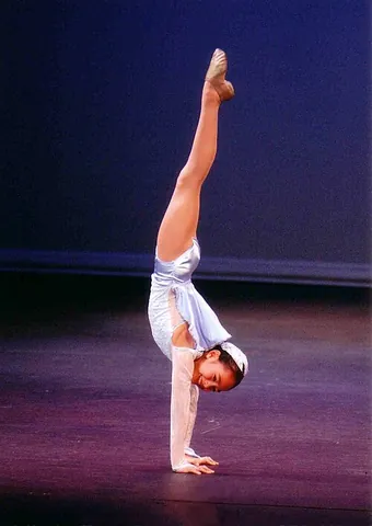 handstand: the act of standing on one's hands, most often in an inverted way
