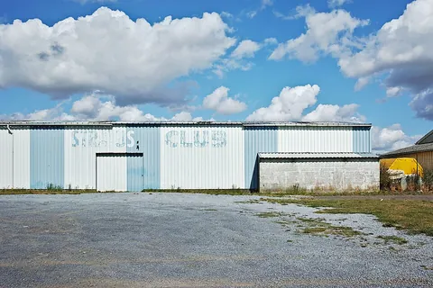 hangar: a large garagelike structure where aircraft are kept