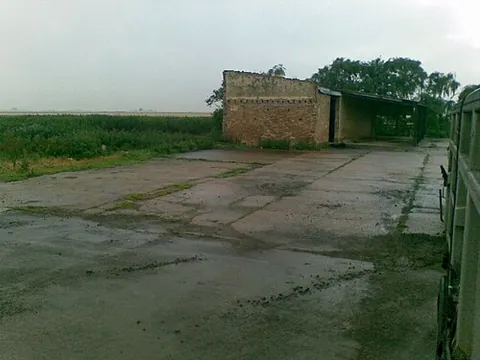 hardstand: open ground, having a hard surface, used for the storage of material or the parking of vehicles