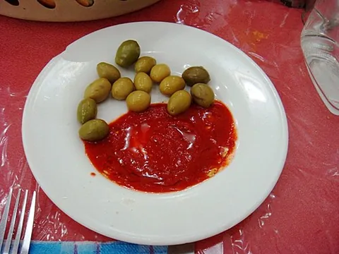 harissa: a North African spice mix, containing chillis, garlic and salt, used as both a condiment and an...