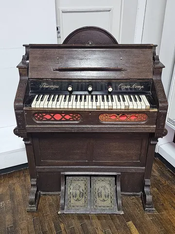 harmonium: a small keyboard instrument that consists of a series of reed pipes, which sound when one of the...