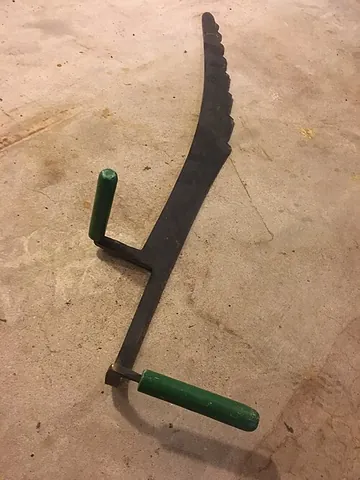 hay knife: an agricultural hand tool, a long-bladed, sometimes serrated knife for cutting sections from a pile...