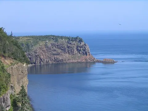 headland: coastal land that juts into the sea
