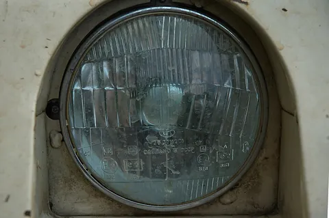 headlight: a bright light, with a lens and reflector, on the front of a motor vehicle (or originally a ship or...