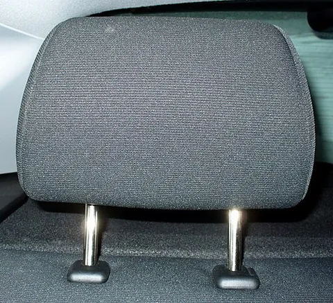 headrest: the part of a seat designed to support the sitter's head