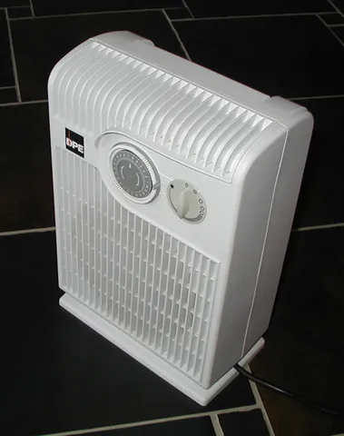 heater: a device that produces and radiates heat, typically to raise the temperature of a room or building