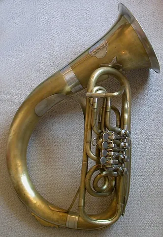 helicon: a large tuba whose coils fit around the player's shoulders